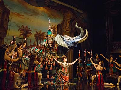 A performance on the opera stage within the Palais Garnier world