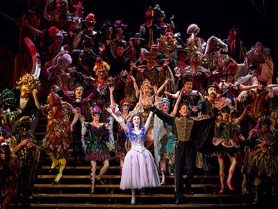 The show’s hallmark spiral staircase and lavish costumes