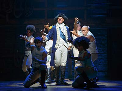 Hamilton cast celebrating their 11 Tony Awards including Best Musical
