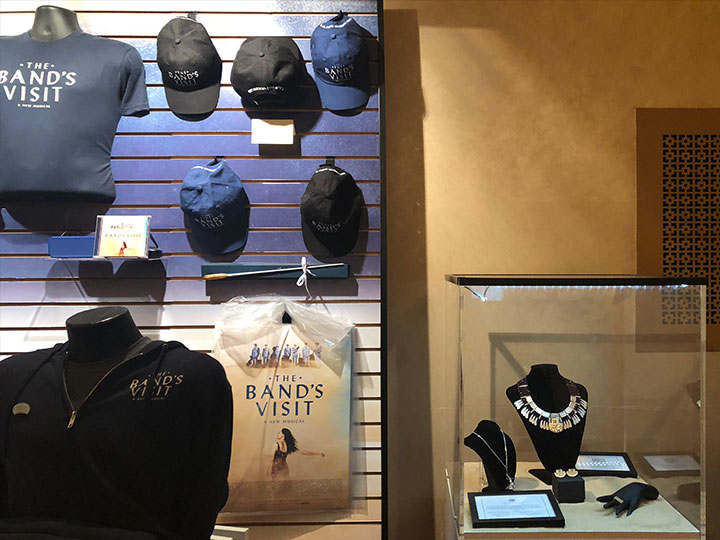 Merch stands next to the box office and downstairs