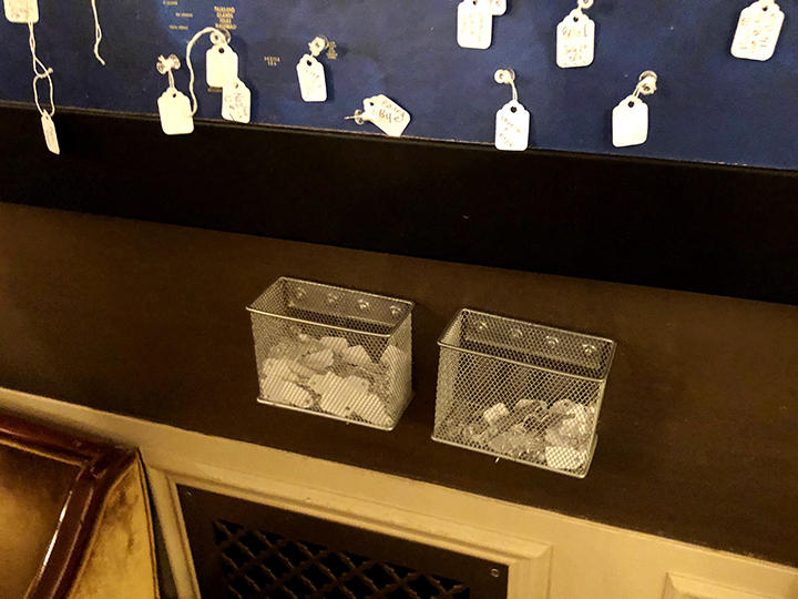Tags displayed inside the theater showing where audience members came from