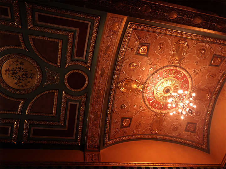 Intricate red toned ceiling decorations