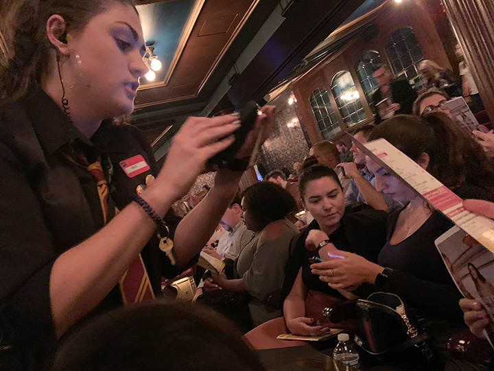 Theater staff taking seat-side orders