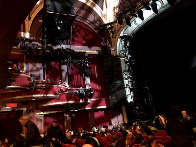 Speakers and subwoofers on the right wall of the orchestra level