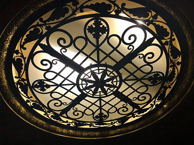 Stained-glass-style dome above the orchestra ceiling