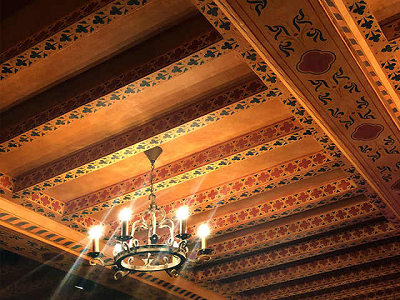 A chic chandelier on the mezzanine ceiling