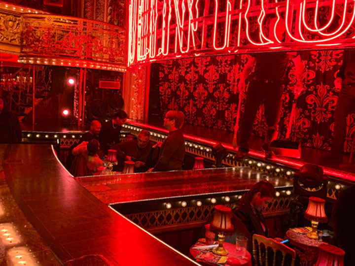 The special Can Can Seats sit just beneath the runway that extends from the stage