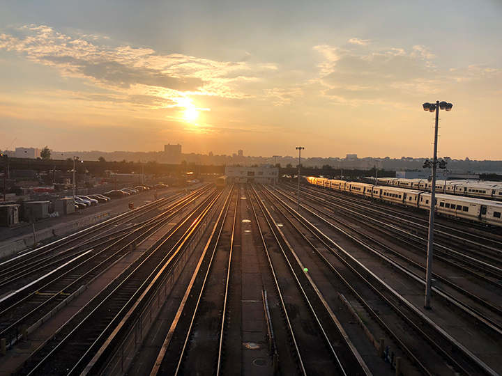 Sunset over the train yard and the Hudson River