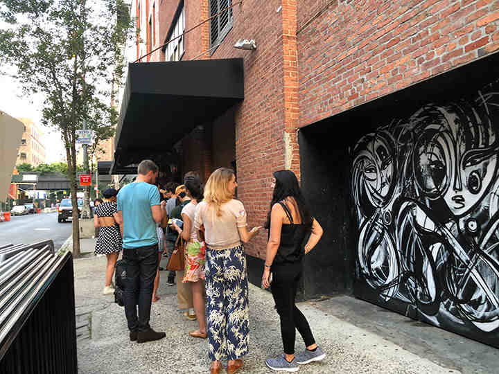 Around 60 people waiting in line before 8 PM