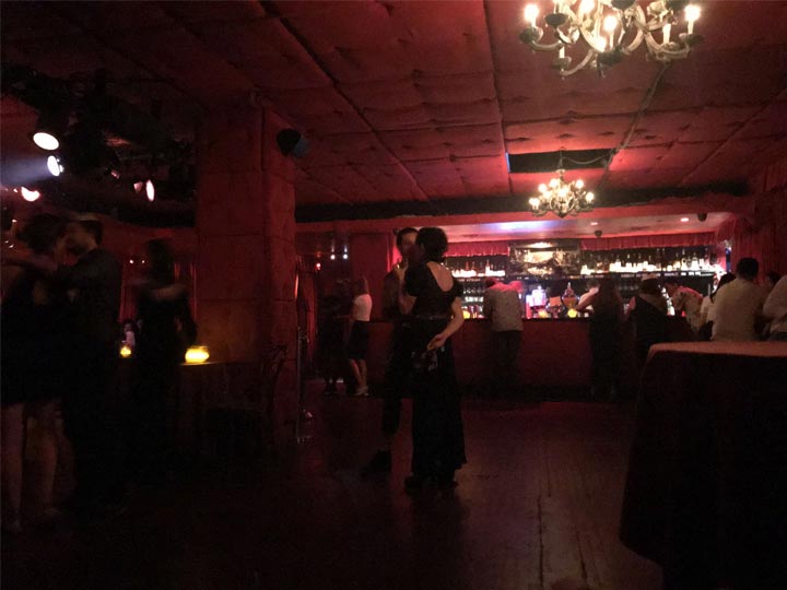 Low-lit lounge with a bar counter