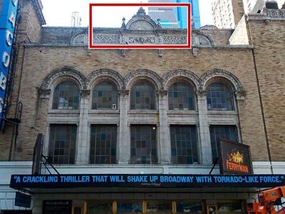 Facade of the Bernard B. Jacobs Theatre designed in modern Spanish style, with musical instruments carved into the upper details