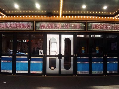 Front entrance of the Lena Horne Theatre with its 1950s-60s style neon signage and lights