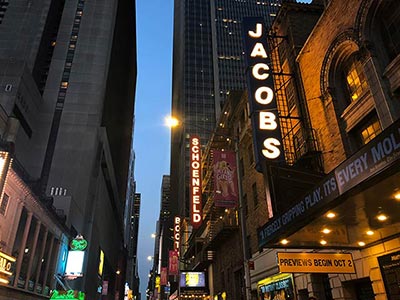 The Schoenfeld, Jacobs, Booth, and John Golden Theatres closely side by side on 45th Street
