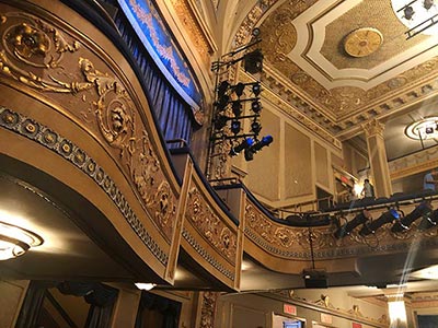 The theatre’s interior features bright gold accents and classic boxes