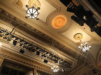 The beige-colored ceiling was restored to reduce glare from lighting