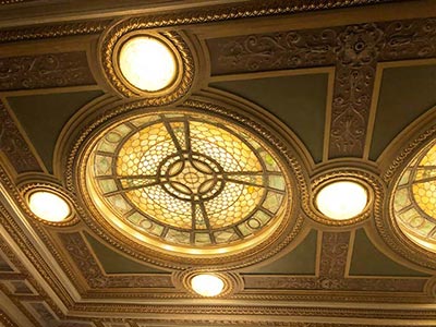 Eric Paris restoring the Tiffany stained glass at the Hudson Theatre