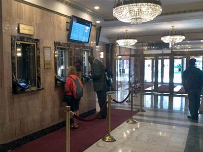 Chandelier-lit box office and lobby of the Imperial Theatre