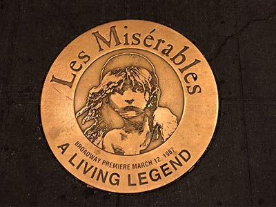 Plaque for 'Les Miserables' embedded in front of the Imperial Theatre