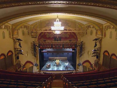 Arched forms define this Modern Spanish-style theater