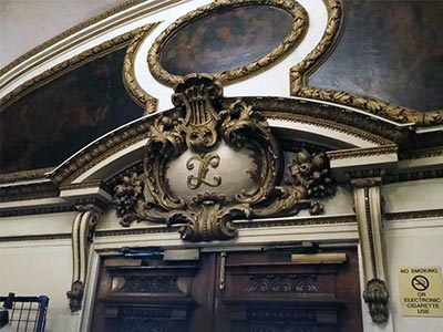 Ornamental letter L above the doors of the Lyceum Theatre
