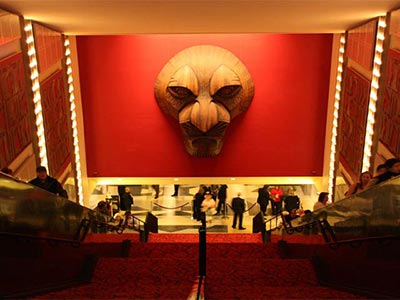 A giant statue of Mufasa stands in the lobby of the Minskoff Theatre
