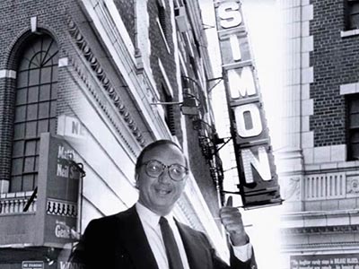 Neil Simon in front of the theatre