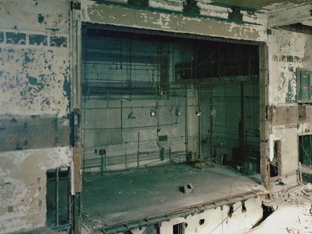 Decayed wooden stage before Disney restoration at the New Amsterdam Theatre