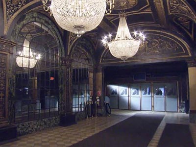 The grand hall of Studio 54 illuminated by chandeliers